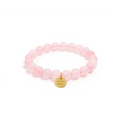 Pulsera de Cuarzo Rosa con dije del signo Zodiacal, bañado en Oro 18K