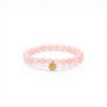 Pulsera de Cuarzo Rosa con dije del signo Zodiacal, bañado en Oro 18K